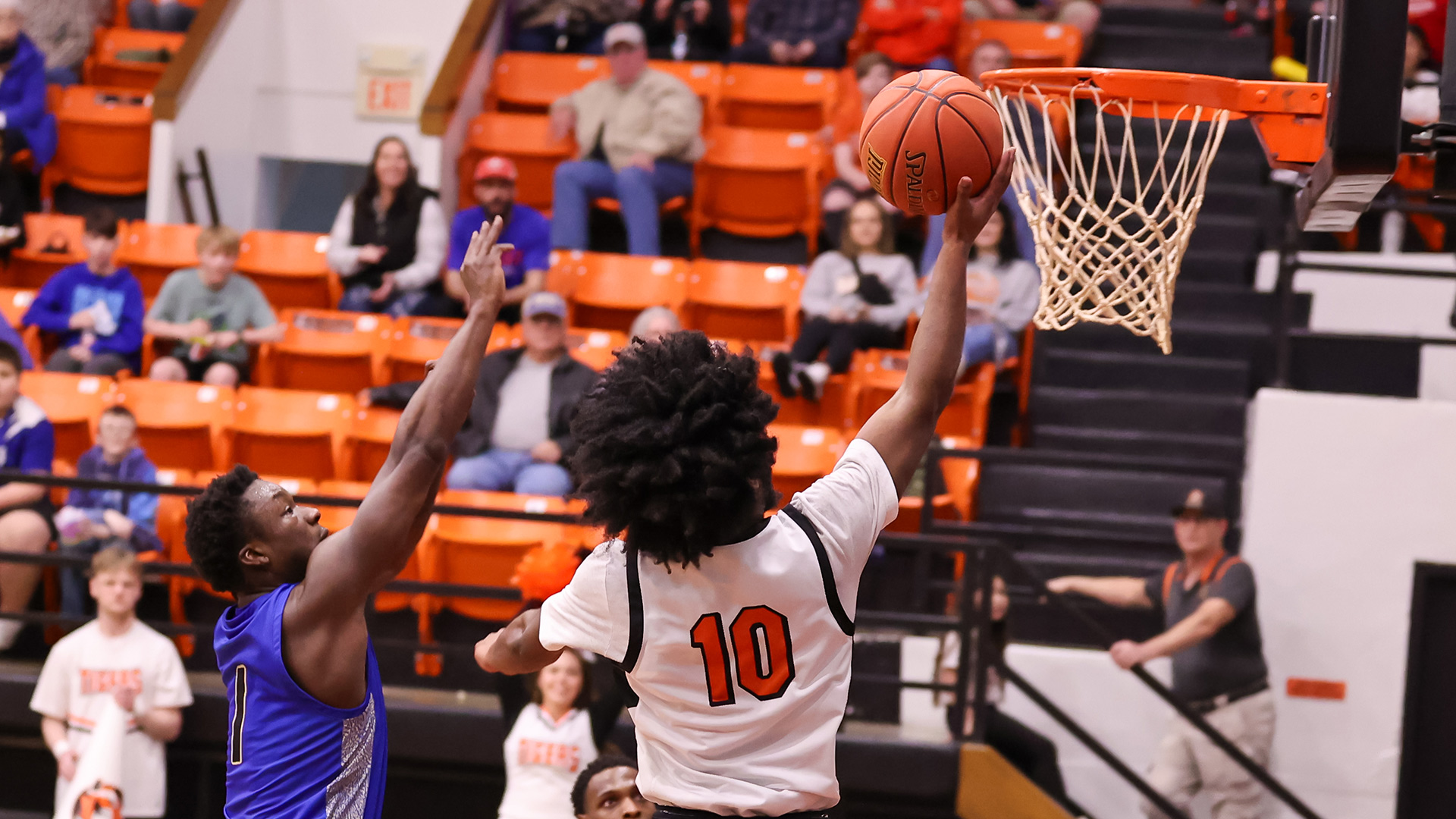 Tigers reach 20-win plateau with 74-66 road win at Garden City
